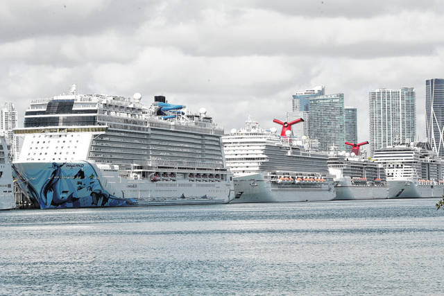 In this March 31, 2020, file photo, cruise ships are docked at PortMiami in Miami. The cruise industry hopes to set sail later this summer.
                                 AP photo