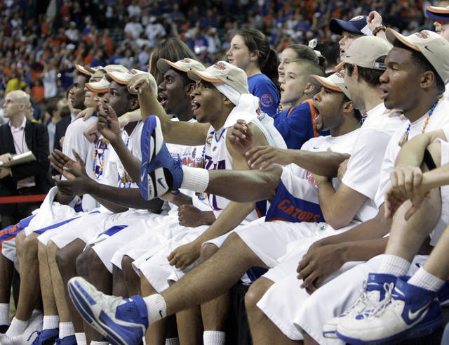 In this April 2, 2007, file photo, the Florida Gators watch the ‘One Shining Moment’ video after winning the title game against Ohio State in Atlanta. Florida won 84-75. Nearly everyone involved in the men’s college basketball tournament, it seems, cherishes a ‘One Shining Moment’ memory.
                                 AP photo