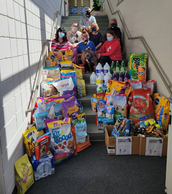 Colbert & Grebas and staff recently donated items to the Griffin Pond Animal Shelter. Pictured receiving the donated items are: From Griffin Pond Shelter: Jackie Galvin, development and communications director; Nick Moczulski, kennel attendant, with Sephora, a shelter pup available for adoption; and Ashley Wolo, executive director; and representing Colbert & Grebas: Ken Motichka, case manager supervisor; Robin Bulzoni, paralegal estate administration; Louise C. Ligi, community outreach and education director; and Thomas Collins, executive director.