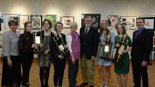 Trophy Award winners from 2020 are shown. From left are: Heather Madeira, contest coordinator; Kristin Pisano; Amelia Grudkowski; Leanna Yatcilla; Sue & Joe Hand, Rossetti contest sponsors; Abbey Stokes; Elizabeth Weed; Michael Hiscox, Rossetti contest volunteer.