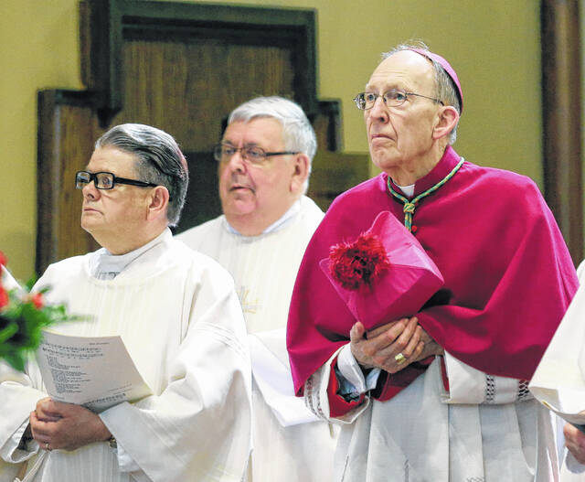 Auxiliary Bishop Emeritus of Scranton John Dougherty, right, presides over the Mass of Thanksgiving commemorating the retirement of Msgr. Joseph Rauscher at St. Nicholas Church in Wilkes-Barre in this 2016 file photo. A Scranton native, Dougherty, 89, died Saturday, diocesan officials said.
                                 Times Leader file photo