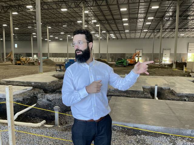 Jason Green, Co-Founder & CEO, Upward Farms, explains the newest 250,283 square-foot indoor farm in Hanover Township — billed as the world’s largest facility of its kind. The farm facility combines modern vertical farming with the ancient farming practice of aquaponics. NorthPoint Development and Upward Farms held a ribbon cutting ceremony Thursday at the facility.
                                 Bill O’Boyle | Times Leader