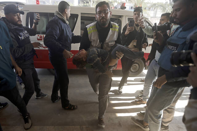 A Palestinian child wounded in the Israeli bombardment of the Gaza Strip in brought to the Nasser hospital in Khan Younis, Southern Gaza Strip, Friday, Dec. 29, 2023.
                                 Mohammed Dahman | AP photo