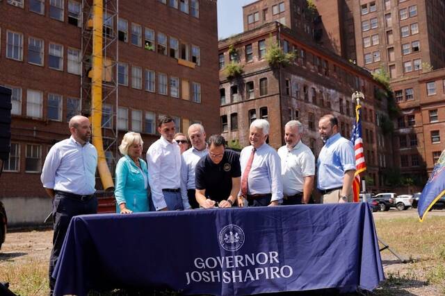 Gov. Josh Shapiro and Department of Community and Economic Development (DCED) Secretary Rick Siger on Tuesday joined Lehigh Valley legislators and local economic development leaders at the Bethlehem Steel General Office (SGO) Building for a ceremonial bill signing of the new bipartisan budget that the governor signed into law last week. From left: Secretary Siger, Sen. Lisa Boscola, Sen. Nick Miller, Don Cunningham, Rep. Steve Samuelson, Rep. Kyle Donahue, Rep. Aaron Kaufer.
                                 Submitted Photo