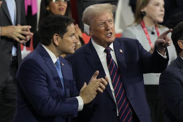 Republican presidential candidate former President Donald Trump talks to Sen. Marco Rubio of Florida during the Republican National Convention Wednesday, July 17, 2024, in Milwaukee.
                                 (AP Photo/Charles Rex Arbogast)