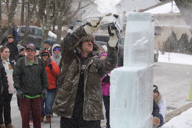 Live ice carvings were done throughout Clarks Summit for the Festival of Ice on Saturday. The ice chunks outside of Our Lady of the Snows, shown here, eventually depicted a shark.
Sam Zavada | Times Leader